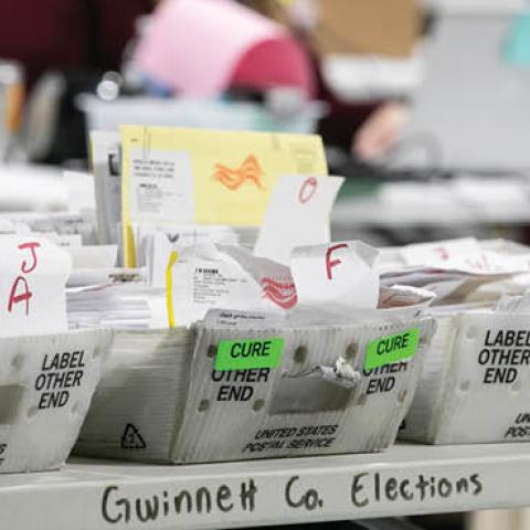 Gwinnett County workers continue to count absentee and provisional ballots at the Gwinnett Voter Registrations and Elections office on November 6, 2020 in Lawrenceville, Georgia.