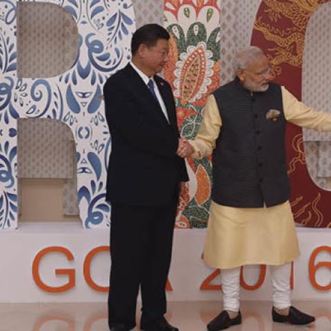Indian Prime Minister Narendra Modi (R) shakes hands with China's President Xi Jinping prior to the BRICS Summit welcoming ceremony at the Taj Exotica hotel in Goa on October 16, 2016.