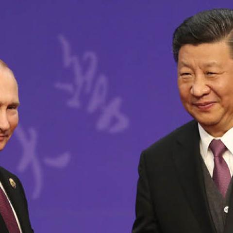 Russian President Vladimir Putin, left, shakes hands with Chinese President Xi Jinping, right, during the Tsinghua Universitys ceremony, at Friendship palace on April 26, 2019 in Beijing, China.