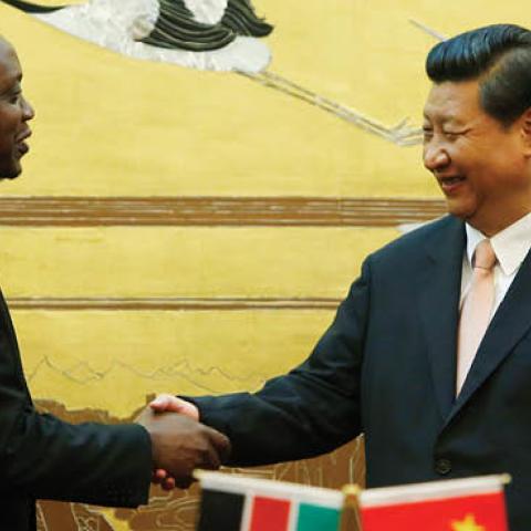 Kenyan President Uhuru Kenyatta (3rd L) and his Chinese President Xi Jinping (3rd R) shake hands during a signing ceremony for a visa exemption agreement in the Great Hall of the People August 19, 2013 in Beijing,
