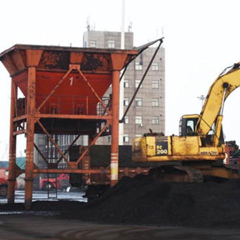 Cranes unload coal from a cargo ship at Lianyungang port on August 19, 2020 in Lianyungang, Jiangsu Province of China