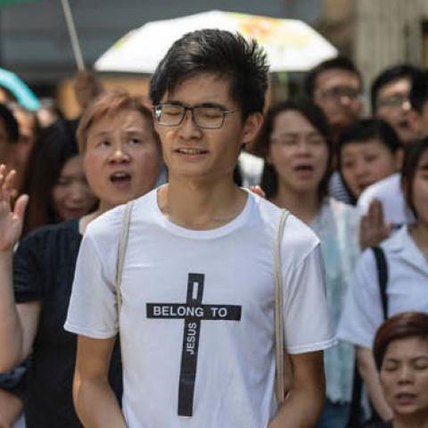 Christian worshippers sing hymns to voice their opposition to an extradition law in Hong Kong, June 14, 2019.