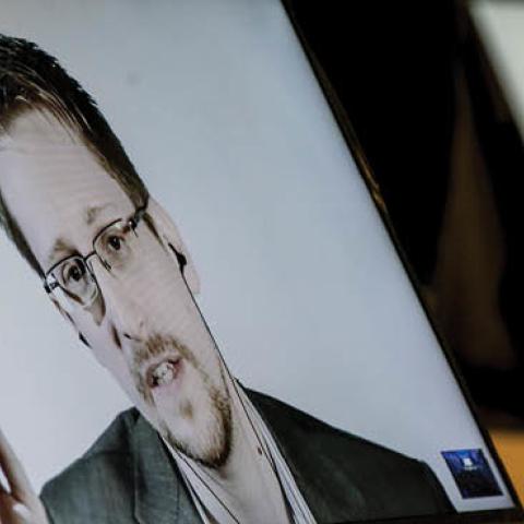 Edward Snowden speaks via video link to participants of the 'MCI alumni and friends' conference at the Congress Innsbruck on October 18, 2018 in Innsbruck, Austria.