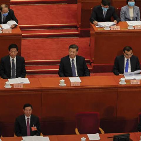 President Xi Jinping, Chinese Premier Li Keqiang, and member of the Standing Committee of the Politburo Li Zhanshu and other attendees sit at the beginning of the Chinese People's Political and Consulting Conference on May 21, 2020