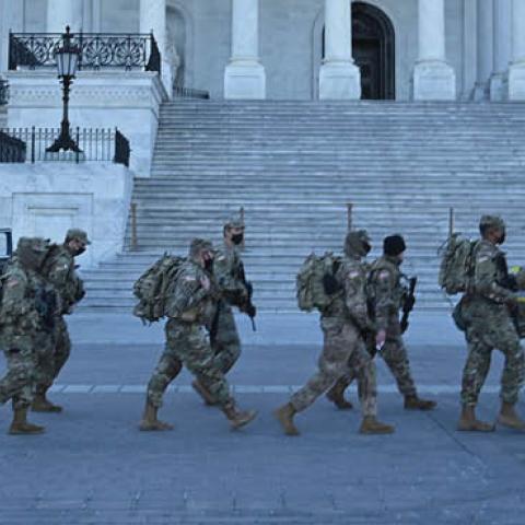 Members of the US National Guard walk outside the US Capitol on January 19, 2021 in Washington, DC