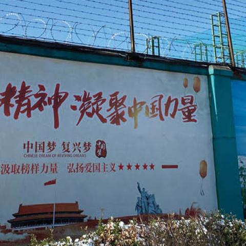 The wall alongside one of the factories in China where Uighur people work and live in dorms.