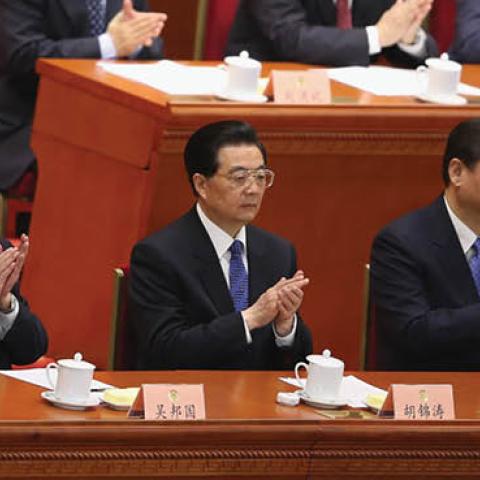 Chinese Premier Wen Jiabao and incoming-Premier Li Keqiang applaud during the closing session of the annual CPPCC held at the Great Hall of the People on March 12, 2013 in Beijing, China