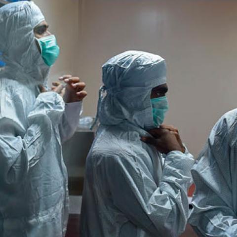 Employees prepare themselves before getting inside a lab where Covishield, AstraZeneca-Oxford's Covid-19 coronavirus vaccine is being manufactured, at India's Serum Institute in Pune on January 22, 2021.