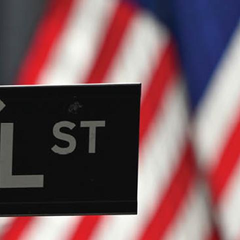 A Wall Street sign at the New York Stock Exchange (NYSE) on February 17, 2021 in New York City. (Photo by ANGELA WEISS/AFP via Getty Images)