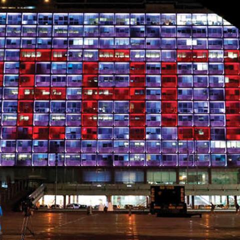 The windows of the Tel Aviv-Yafo Municipality building illuminated with the word "Peace" on September 15, 2020 to celebrate the signing of the landmark Israeli normalisation deals with the UAE and Bahrain. (Photo by JACK GUEZ/AFP via Getty Images)