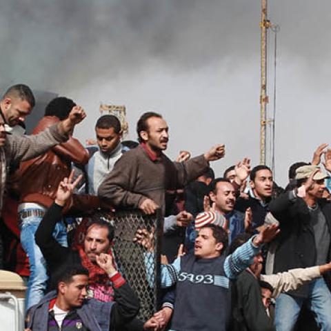 Protestors chant as they ride on an army tank transporter in Tahrir Square on January 29, 2011 in Cairo, Egypt (Photo by Peter Macdiarmid/Getty Images)