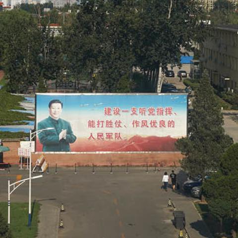 A propaganda billboard depicting Chinese President Xi Jinping in Beijing, China. The sign reads: "We should build a people's army with a good style of work, able to win battles under the command of the Party". (Photo by Andrea Verdelli/Getty Images)