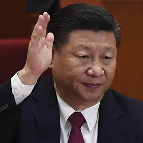 Chinese President Xi Jinping (C) raises his hand to vote for the reports with other China's leaders at the closing of the 19th Communist Party Congress at the Great Hall of the People in Beijing on October 24, 2017 (WANG ZHAO/AFP via Getty Images)