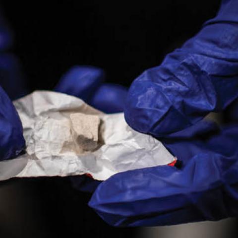 A police offers shows heroine/fentanyl that was part of a kit that a woman was preparing to shoot inside a Walmart's bathroom on Sunday, February 10, 2019, in Manchester, NH. (Salwan Georges/The Washington Post via Getty Images)