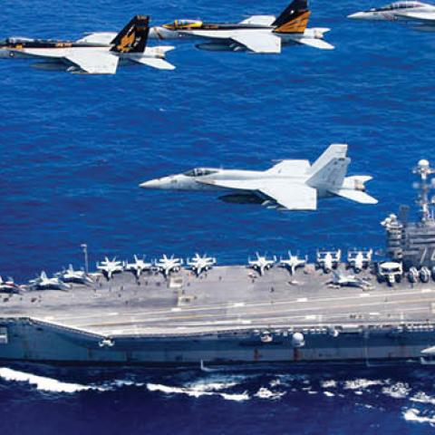 A combined formation of aircraft from Carrier Air Wing (CVW) 5 and Carrier Air Wing (CVW) 9 pass in formation above the Nimitz-class aircraft carrier USS John C. Stennis (CVN 74) (Photo by Lt. Steve Smith/U.S. Navy via Getty Images)