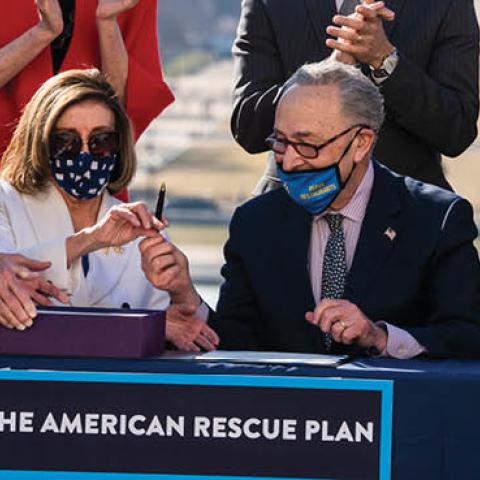 House Majority Leader Steny Hoyer, Speaker of the House Nancy Pelosi, and Senate Majority Leader Chuck Schumer, sign the American Rescue Plan Act on the West Front of the Capitol (Photo By Tom Williams/CQ-Roll Call, Inc via Getty Images)