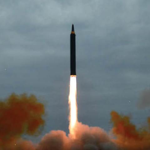 North Korea's intermediate-range strategic ballistic rocket Hwasong-12 lifting off from the launching pad at an undisclosed location near Pyongyang (STR/AFP via Getty Images)