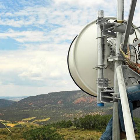 A tower technician for Advanced Wireless Solutions works to make repairs on the dish on the Pollard cell tower in rural Rio Blanco County near Meeker, Colorado (Photo by Helen H. Richardson/MediaNews Group/The Denver Post via Getty Images)