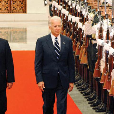 Chinese Vice President Xi Jinping accompanies U.S. Vice President Joe Biden to view an honor guard during a welcoming ceremony inside the Great Hall of the People on August 18, 2011 in Beijing, China (Photo by The Asahi Shimbun via Getty Images)