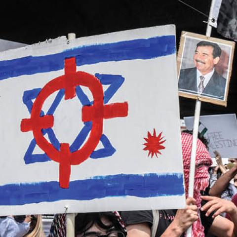 People participate in a pro-Palestinian rally on May 22, 2021 in the Queens borough of New York City. After the recent ceasefire between Israelis and Palestinians, activists in New York protested for an end to the Israeli occupation of Palestine. (Photo b