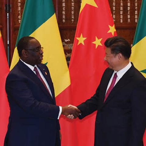 Chinese President Xi Jinping (R) shakes hands with Senegalese President Macky Sall (L) during a meeting at the West lake State Guest House in Hangzhou, Zhejiang Province on September 2, 2016 (IWASAKI MINORU/AFP via Getty Images)