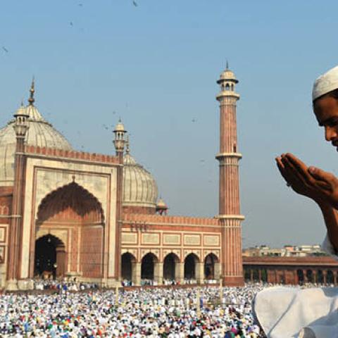 An Indian Muslim devotee offers prayers during Eid al-Adha at Jama Masjid in New Delhi on October 6, 2014 (Photo credit should read Chandan Khanna/AFP via Getty Images)