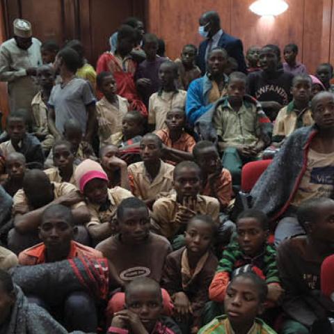 Released students gather at the Government House with other students from the Government Science Secondary school, in Kankara, in northwestern Katsina State, Nigeria upon their release on December 18, 2020 (Photo by KOLA SULAIMON/AFP via Getty Images)