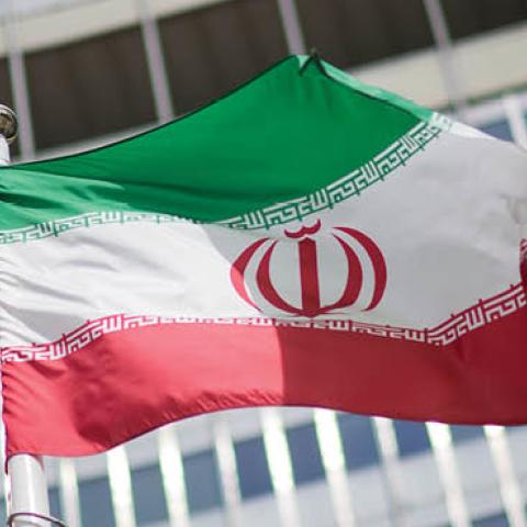 The flag of Iran is seen in front of the building of the International Atomic Energy Agency (IAEA) Headquarters ahead of a press conference by Rafael Grossi, Director General of the IAEA, about the agency's monitoring of Iran's nuclear energy program on M