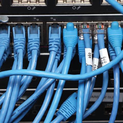 Network cables are plugged in a server room on November 10, 2014 in New York City (Photo by Michael Bocchieri/Getty Images)