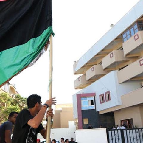 Libyan protesters gather outside the offices of Muslim Brotherhood-backed Party of Justice and Construction, in the Libyan capital Tripoli on July 27, 2013 (MAHMUD TURKIA/AFP via Getty Images)