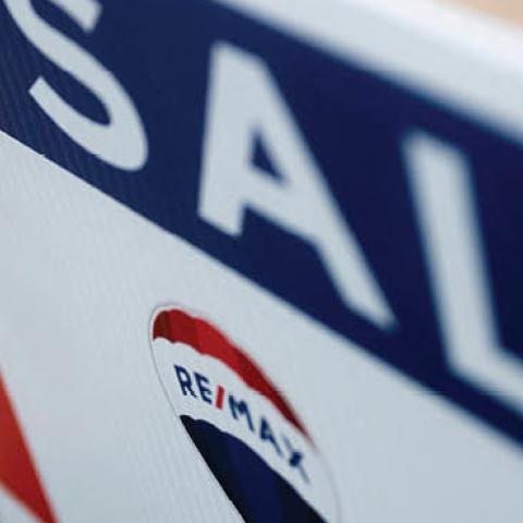 A reality sign in front of a for sale home in Annapolis, Maryland, on July 6, 2021. (Photo by JIM WATSON / AFP) 