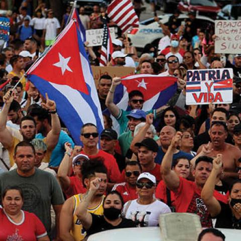 Protesters gather in front of the Versailles restaurant to show support for the people in Cuba who have taken to the streets there to protest on July 11, 2021 in Miami, Florida (Photo by Joe Raedle/Getty Images)
