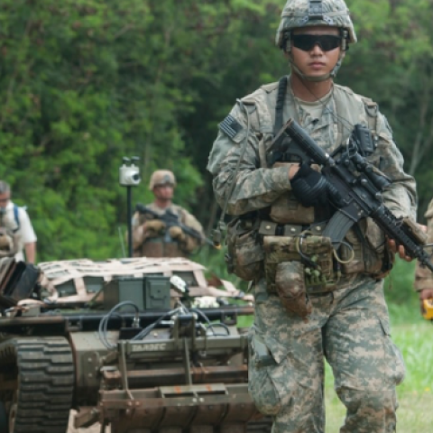 U.S. soldiers move in formation while controlling unmanned vehicles as part of an exercise in 2016 at Marine Corps Training Area Bellows, Hawaii. (Staff Sgt. Christopher Hubenthal/U.S. Air Force)