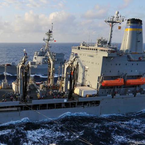 The amphibious assault ship USS Wasp (LHD 1) conducts a replenishment-at-sea with the fleet replenishment oiler USNS Tippecanoe (T-AO 199) and the Arleigh Burke-class guided missile destroyer USS Dewey (DDG 105) (U.S. Navy Photo)