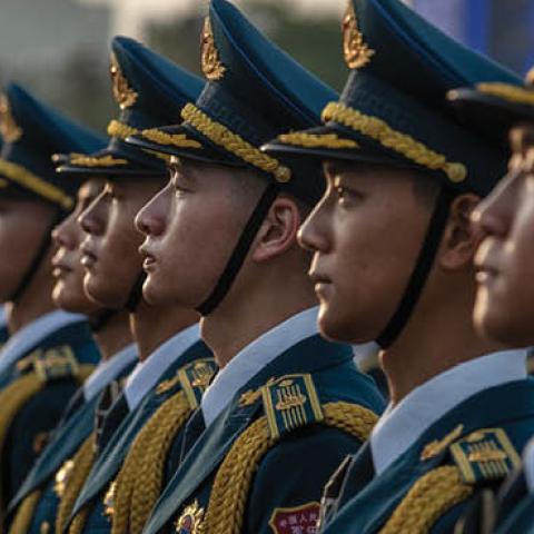 Members of a People's Liberation Army band stand together at a ceremony marking the 100th anniversary of the Communist Party on July 1, 2021 at Tiananmen Square in Beijing, China. (Photo by Kevin Frayer/Getty Images)