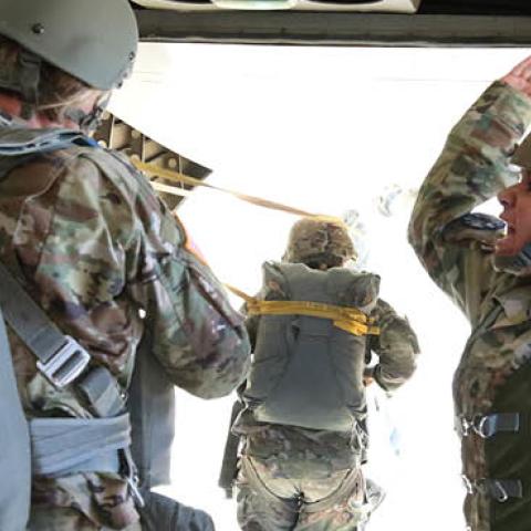 A Jumpmaster from the U.S. Army John F. Kennedy Special Warfare Center and School instructs Soldiers to exit a CASA C-212 Aviocar aircraft to jump over Laurinburg-Maxton Airfield March 28, 2019 (U.S. Army photo by K. Kassens)
