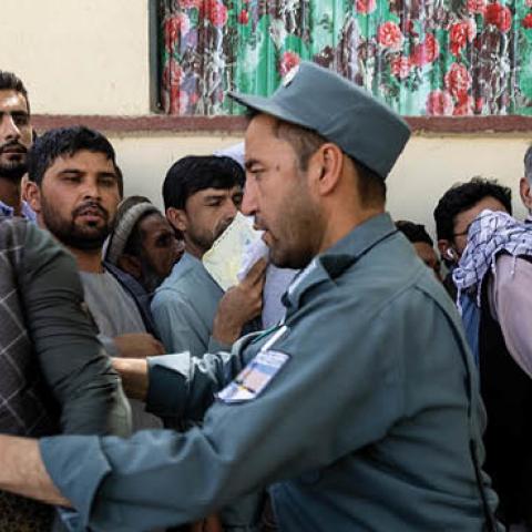 Afghans wait in long lines for hours at the passport office as many are desperate to have their travel documents ready to go on August 14, 2021 in Kabul, Afghanistan (Photo by Paula Bronstein /Getty Images)