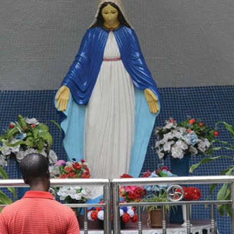 A man prays at Mary Grotto at St Leo Church, Ikeja, Lagos. Members of St. Leo Catholic Church, Ikaja in Lagos Nigeria, dramatize the Station of the Cross, suffering and death of Jesus Christ on Good Friday, April 14 2017 (Photo by Adekunle Ajayi/NurPhoto 