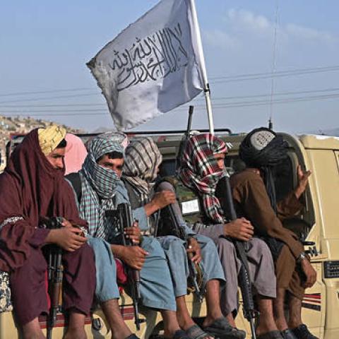 Taliban fighters in a vehicle patrol the streets of Kabul on August 23, 2021 (Photo by WAKIL KOHSAR/AFP via Getty Images)