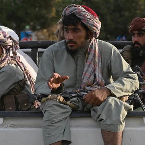 Taliban fighters in a vehicle patrol the streets of Kabul on August 23, 2021 (Photo by WAKIL KOHSAR/AFP via Getty Images)