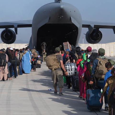 U.S. Air Force loadmasters and pilots load passengers aboard a U.S. Air Force C-17 Globemaster III at Hamid Karzai International Airport (HKIA), Afghanistan, Aug. 24, 2021 (U.S. Air Force photo by Master Sgt. Donald R. Allen)