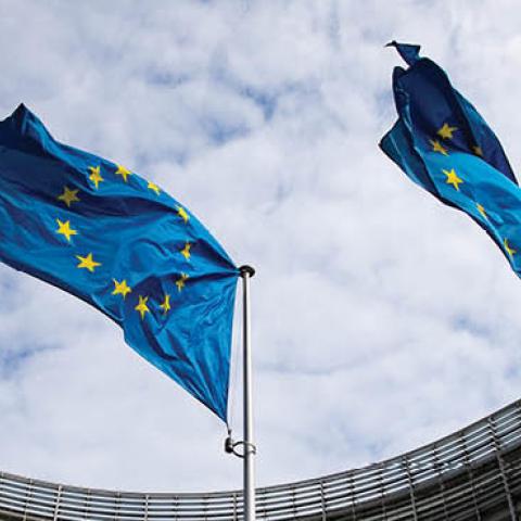 European flags flutter in the wind in front of the Berlaymont building, the seat of the European Commission (Photo by Marcel Kusch/picture alliance via Getty Images)