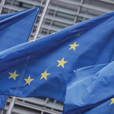 European Union flags fly outside the European Commission building in Brussels, on December 7, 2020. (Photo by Kenzo Tribouillard/AFP via Getty Images)