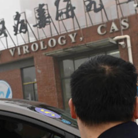 Members of the World Health Organization (WHO) team investigating the origins of the COVID-19 coronavirus arrive by car at the Wuhan Institute of Virology in Wuhan on February 3, 2021. (Photo by HECTOR RETAMAL/AFP via Getty Images)