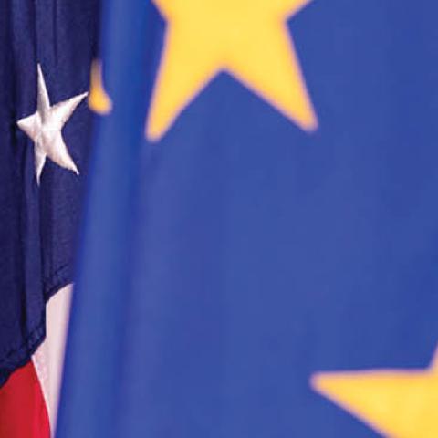 The European Union and United States flags on display. (Photo by Samuel Corum/Getty Images)