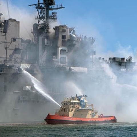 Sailors and Federal Firefighters combat a fire onboard USS Bonhomme Richard (LHD 6) at Naval Base San Diego, July 12. (U.S. Navy photo by Mass Communication Specialist 3rd Class Christina Ross)