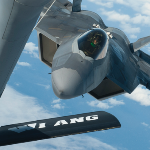 A Hawaii Air National Guard F-22 Raptor approaches a Wisconsin Air National Guard KC-135 Stratotanker to receive aerial refueling over the Pacific Ocean. (John Linzmeier/US Air National Guard)