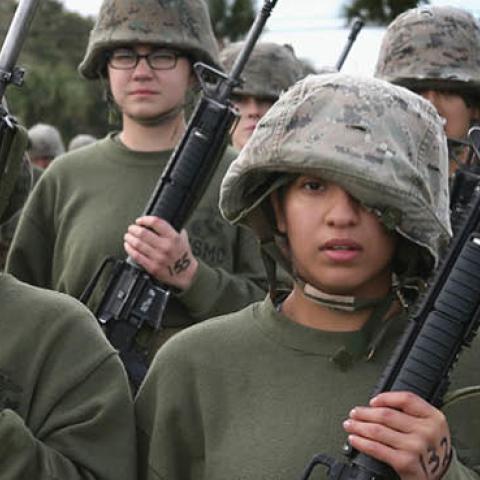 Female Marine recruits stand in formation following hand-to-hand combat training during boot camp February 27, 2013 at MCRD Parris Island, South Carolina. (Photo by Scott Olson/Getty Images)