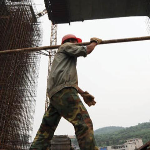 A worker at a construction site of a new bridge project on June 20, 2009 in Guiyang of Guizhou Province, China. (Photo by Wu Dongjun/Visual China Group via Getty Images)