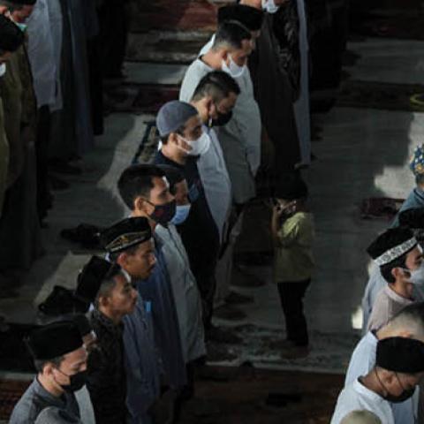 Acehnese Muslims are seen attending Eid al-Fitr prayer which marks the end of the holy month of Ramadan at the Islamic Center Mosque in Lhokseumawe, on May 13, 2021, Aceh Province, Indonesia. (Photo by Fachrul Reza/NurPhoto via Getty Images)